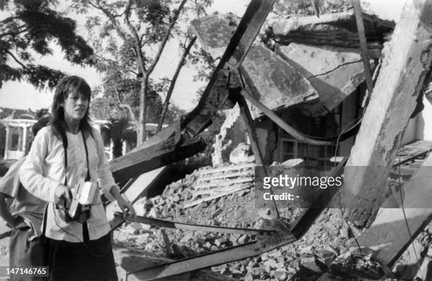 Actress and peace activist Jane Fonda, holding a camera, visits 25 July 1972 a Hanoi site bombed by US airplanes. Fonda's trip to North Vietnam was...