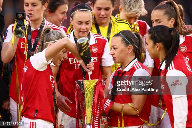 Katie McCabe and Leah Williamson of Arsenal celebrate with the FA Women's Continental Tyres League Cup trophy following the FA Women's Continental...