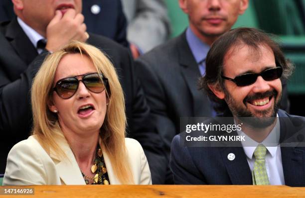 Author J.K. Rowling with her husband Neil Murray in the Royal Box on Center Court on the second day of the 2012 Wimbledon Championships tennis...
