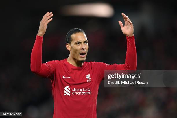 Virgil van Dijk of Liverpool celebrates after Mohamed Salah of Liverpool scores the side's fourth goal during the Premier League match between...