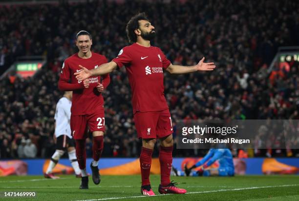 Mohamed Salah of Liverpool celebrates after scoring the team's fourth goal as David De Gea of Manchester United reacts during the Premier League...