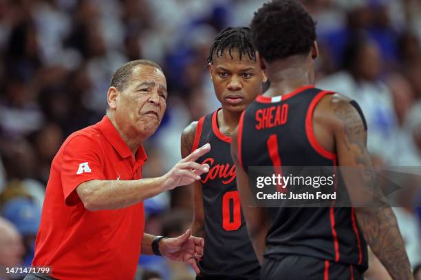 Head coach Kelvin Sampson of the Houston Cougars instructs Marcus Sasser and Jamal Shead during the first half against the Memphis Tigers at...