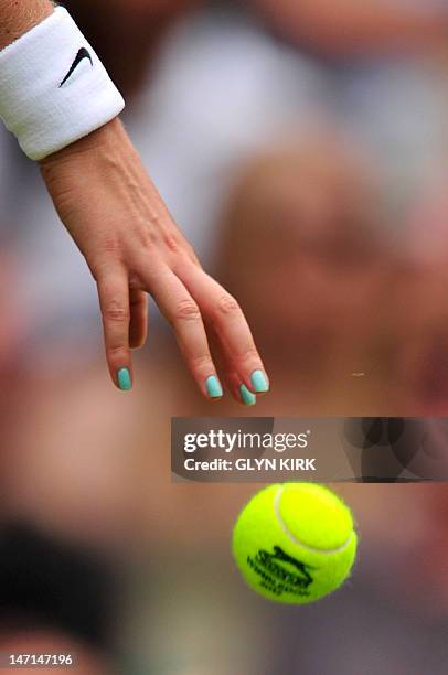 Close up of the hand of Czech Republic's Petra Kvitova bouncing the ball during her first round women's singles match against Uzbekistan's Akgul...