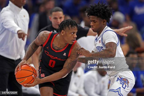 Kendric Davis of the Memphis Tigers guards Marcus Sasser of the Houston Cougars during the first half at FedExForum on March 05, 2023 in Memphis,...