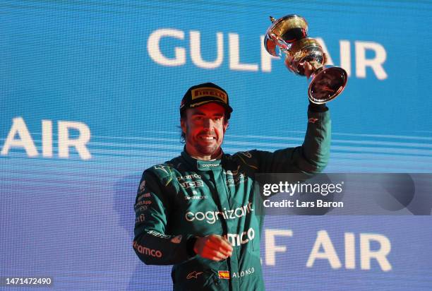 Third placed Fernando Alonso of Spain and Aston Martin F1 Team celebrates on the podium during the F1 Grand Prix of Bahrain at Bahrain International...