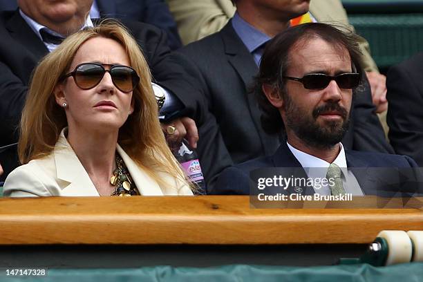 Author J. K. Rowling and Neil Murray watch the Ladies' Singles first round match between Petra Kvitova of the Czech Republic and Akgul Amanmuradova...
