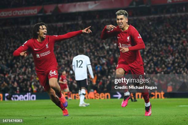 Roberto Firmino of Liverpool celebrates after scoring the team's seventh goal with teammate Trent Alexander-Arnold during the Premier League match...
