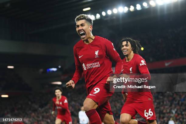 Roberto Firmino of Liverpool celebrates after scoring the team's seventh goal with teammate Trent Alexander-Arnold during the Premier League match...