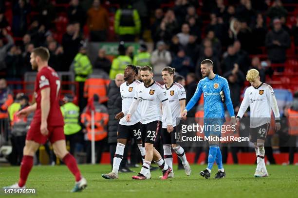 Players of Manchester United look dejected as they leave the field, after being defeated 7-0 during the Premier League match between Liverpool FC and...