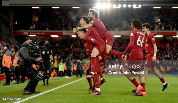 Roberto Firmino of Liverpool celebrates after scoring the seventh goal during the Premier League match between Liverpool FC and Manchester United at...
