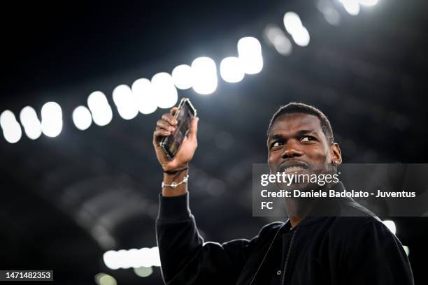 Paul Pogba of Juventus greets the fans during inspections the pitch prior to the Serie A match between AS Roma and Juventus at Stadio Olimpico on...