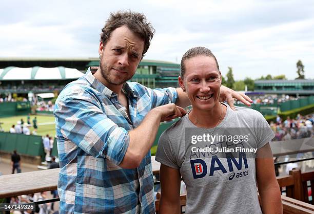 Comedian Hamish Blake poses for photographs with Samantha Stosur of Australia on day two of the Wimbledon Lawn Tennis Championships at the All...