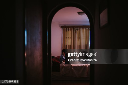 Screen Overload: Preteen Boy Using Cellphone in Bed After Dark Screen Overload: Preteen Boy Using Cellphone in Bed After Dark