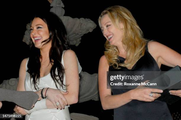 Actresses Lindsay Lohan and Virginia Madsen share a laugh at The Malibu Celebration of Film Gala in honor of filmmaker Robert Altman on October 7,...