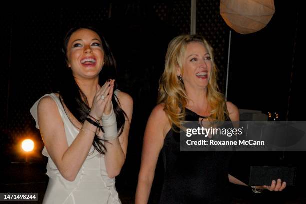 Actresses Lindsay Lohan and Virginia Madsen share a laugh at The Malibu Celebration of Film Gala in honor of filmmaker Robert Altman on October 7,...