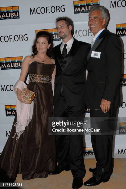 Actress Sherilyn Fenn, with a guest and writer/director Daniel Day Stewart arrive at the Malibu Celebration of Film Gala honoring filmmaker Robert...
