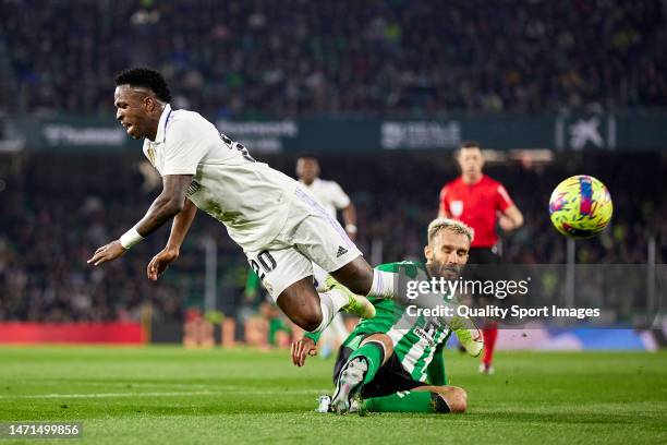 Vinicius Junior of Real Madrid is tackled by German Pezzella of Real Betis during the LaLiga Santander match between Real Betis and Real Madrid CF at...