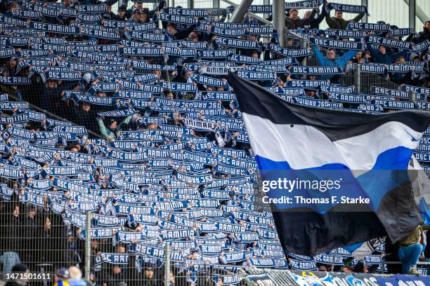 Supporters of Bielefeld cheer their team during the Second Bundesliga match between Eintracht Braunschweig and DSC Arminia Bielefeld at...