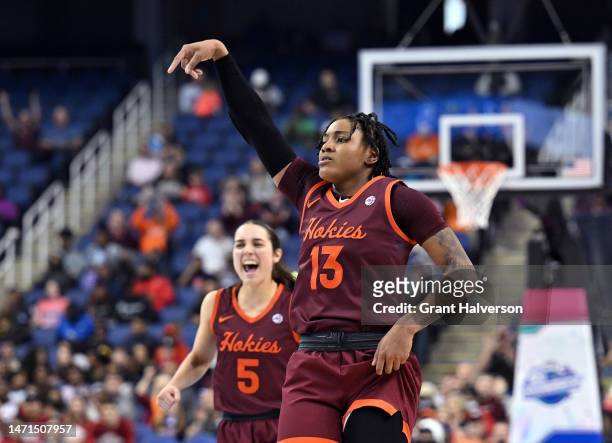 Taylor Soule and Georgia Amoore of the Virginia Tech Hokies reacts after a three-point basket by Soule against the Louisville Cardinals during the...