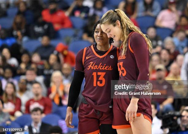 Taylor Soule and Elizabeth Kitley of the Virginia Tech Hokies huddle during the final seconds of the game against the Louisville Cardinals in the ACC...