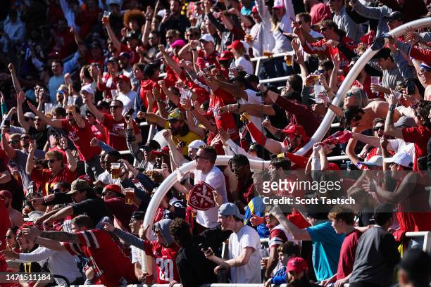 Defenders fans cheer with the beer cup snake after a touchdown during the second half of the XFL game against the St Louis Battlehawks at Audi Field...