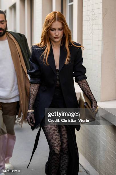 Camille Razat wears black blazer, tights, bag outside Victoria Beckham during the Paris Fashion Week - Womenswear Fall Winter 2023 2024 : Day Five on...