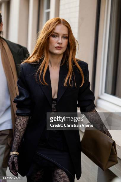 Camille Razat wears black blazer, tights, bag outside Victoria Beckham during the Paris Fashion Week - Womenswear Fall Winter 2023 2024 : Day Five on...