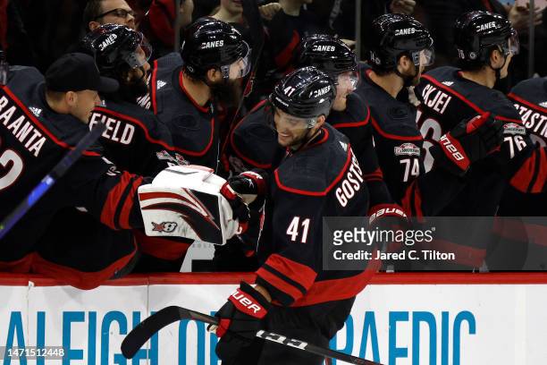 Shayne Gostisbehere of the Carolina Hurricanes celebrates with his team following a goal scored during the second period of the game against the...
