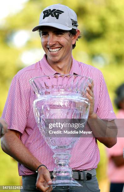 Nico Echavarria of Columbia holds the trophy on the 18th green after winning the Puerto Rico Open at Grand Reserve Golf Club on March 05, 2023 in Rio...