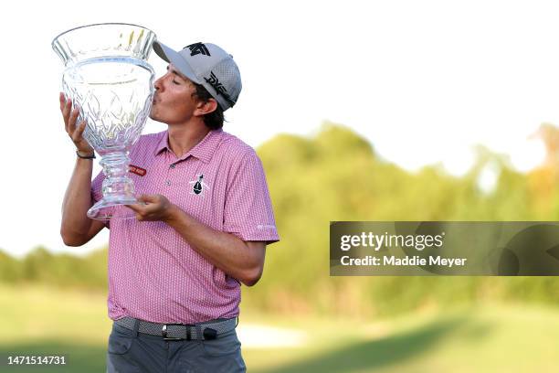 Nico Echavarria of Columbia poses with the trophy on the 18th green after winning the Puerto Rico Open at Grand Reserve Golf Club on March 05, 2023...