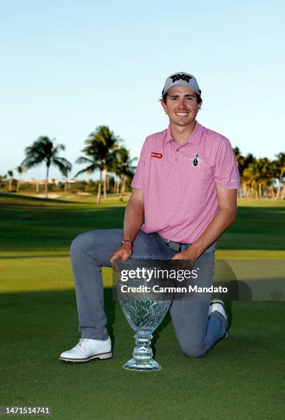 Nico Echavarria of Columbia poses with the trophy on the 18th green after winning the Puerto Rico Open at Grand Reserve Golf Club on March 05, 2023...