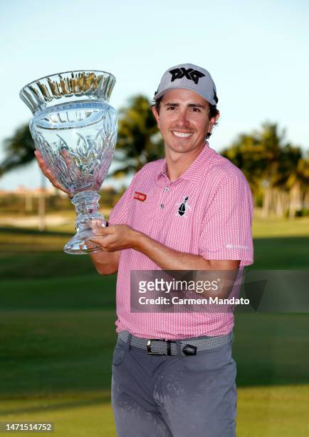 Nico Echavarria of Columbia poses with the trophy on the 18th green after winning the Puerto Rico Open at Grand Reserve Golf Club on March 05, 2023...