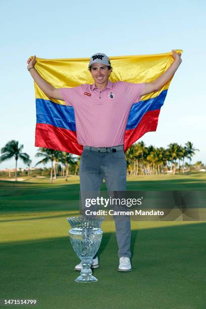 Nico Echavarria of Columbia poses with the trophy on the 18th green after winning the Puerto Rico Open at Grand Reserve Golf Club on March 05, 2023...