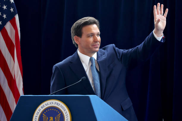 Florida Gov. Ron DeSantis waves to the crowd after speaking about his new book, The Courage to Be Free, at Air Force One Pavilion.