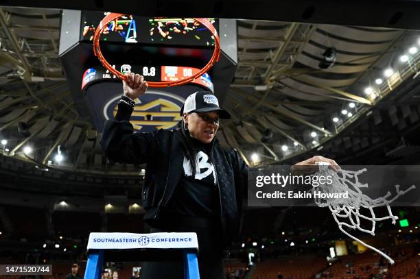 Head coach Dawn Staley of the South Carolina Gamecocks cuts down the net following their win over the Tennessee Lady Vols for the SEC Women's...