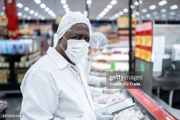 portrait of an inspector in the supermarket - food and drug administration stock pictures, royalty-free photos & images