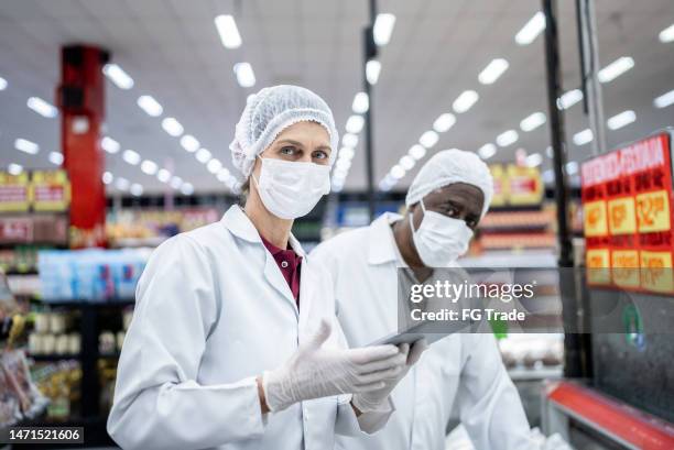 portrait of an inspector in the supermarket - food and drug administration stock pictures, royalty-free photos & images