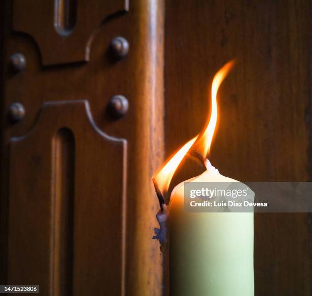 candle with two flames - birthday candle on black stock pictures, royalty-free photos & images