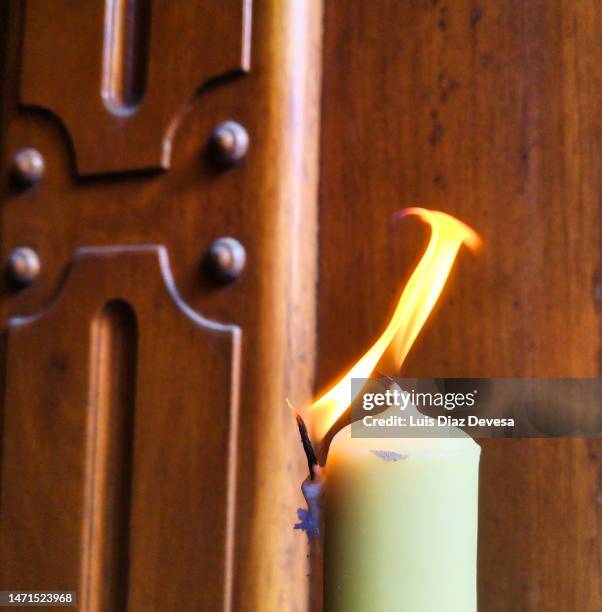 candle with two flames - birthday candle on black stock pictures, royalty-free photos & images