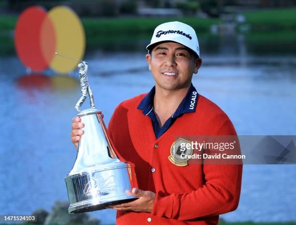 Kurt Kitayama of The United States holds the trophy after his one-shot win in the final round of the Arnold Palmer Invitational presented by...
