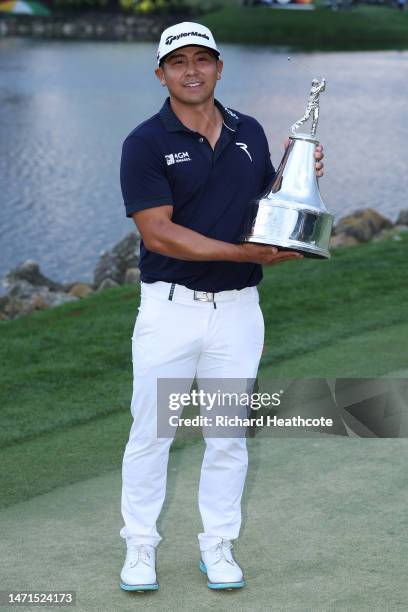 Kurt Kitayama of the United States celebrates with the trophy after winning during the final round of the Arnold Palmer Invitational presented by...