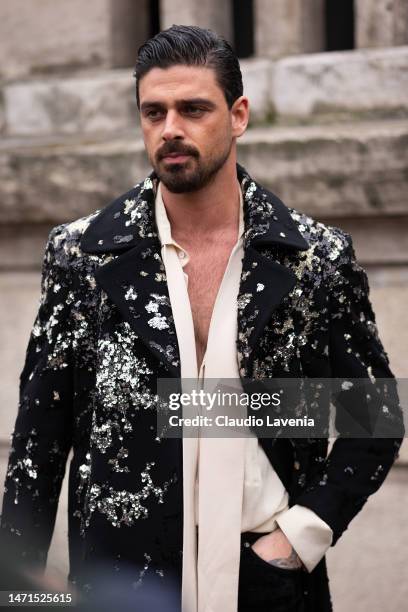 Michele Morrone wears a black and silver sequins blazer and cream blouse, outside Elie Saab, during Paris Fashion Week - Womenswear Fall Winter 2023...
