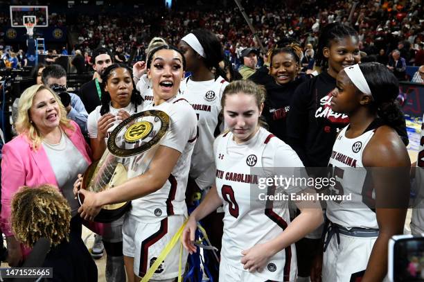 Brea Beal of the South Carolina Gamecocks holds the trophy following their win over the Tennessee Lady Vols for the SEC Women's Basketball...