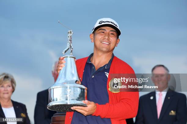 Kurt Kitayama of the United States celebrates with the trophy at the trophy ceremony after winning during the final round of the Arnold Palmer...