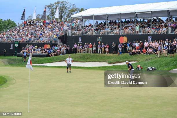 Kurt Kitayama of The United States hits his long putt that came to rest less than an inch from the hole on the 18th green to secure his one shot win...