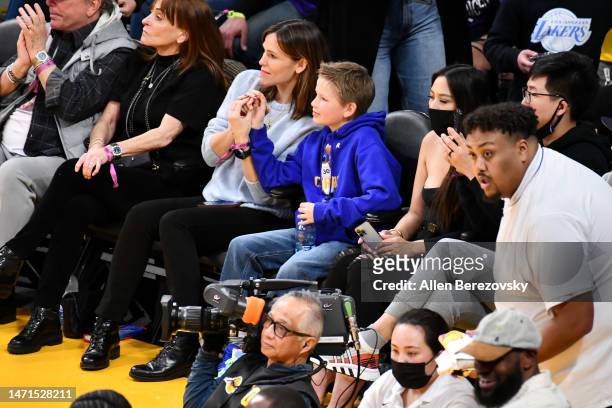 Jennifer Garner and her son Samuel Garner Affleck attend a basketball game between the Los Angeles Lakers and the Golden State Warriors at Crypto.com...