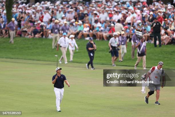 Kurt Kitayama of the United States acknowledges fans as he walks up the 18th hole during the final round of the Arnold Palmer Invitational presented...