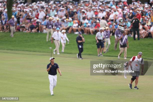 Kurt Kitayama of the United States acknowledges fans as he walks up the 18th hole during the final round of the Arnold Palmer Invitational presented...