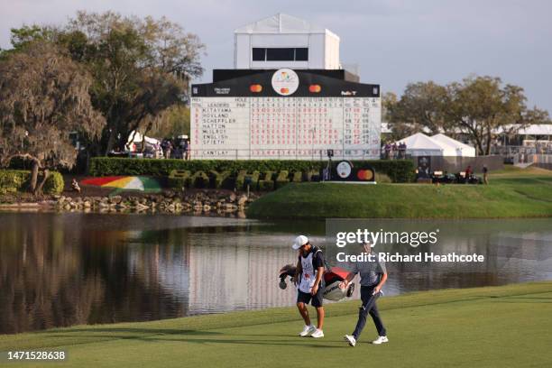 General view is seen as Rory McIlroy of Northern Ireland and caddie Harry Diamond walk up the 18th hole during the final round of the Arnold Palmer...