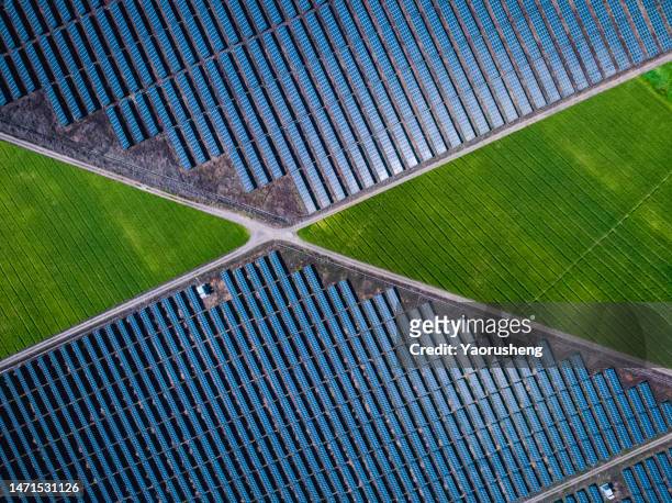 high angle view of solar panel station  , agricultural landscape - overhead power line stock pictures, royalty-free photos & images
